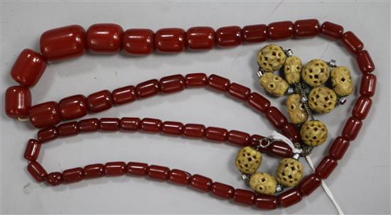 A simulated cherry amber necklace and one other necklace,